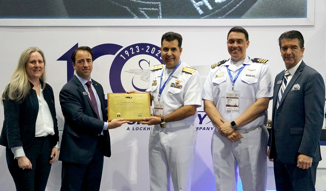 Sikorsky executives Dina Halvorsen, Felipe Benvegnu and Adam Schierholz stand with Brazilian Armed Forces representatives during LAAD 2023, April 12. Sikorsky, a Lockheed Martin company, celebrates its 100th anniversary this year. (Photo: Lockheed Martin)
