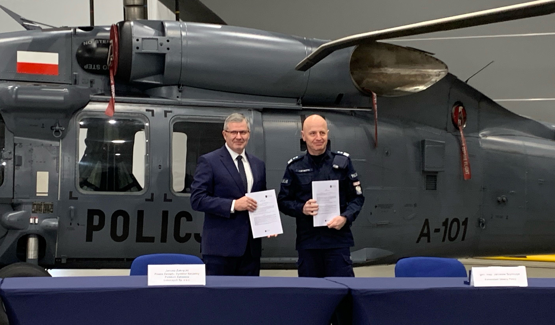 Janusz Zakrecki, PZL Mielec President and General Director, stands with Polish National Police Commander-in-Chief Gen. Insp. Jarosław Szymczyk after finalizing a contract for two additional S-70i Black Hawk helicopters on Dec. 9, 2022.
